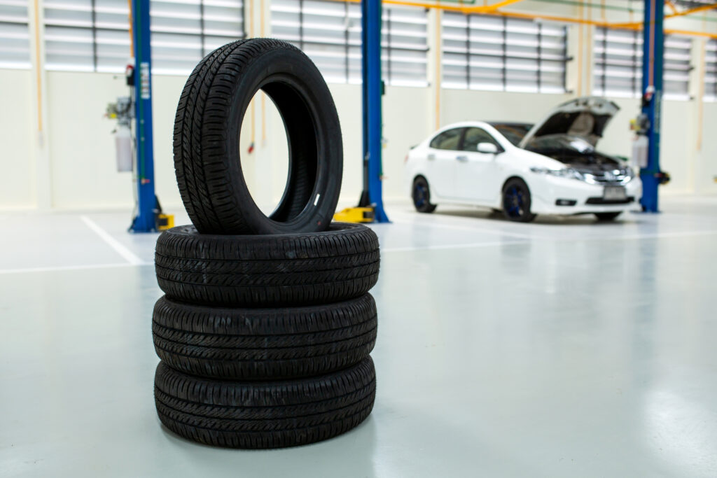 New tires that change tires in the auto repair service center, new car tires and blurred background